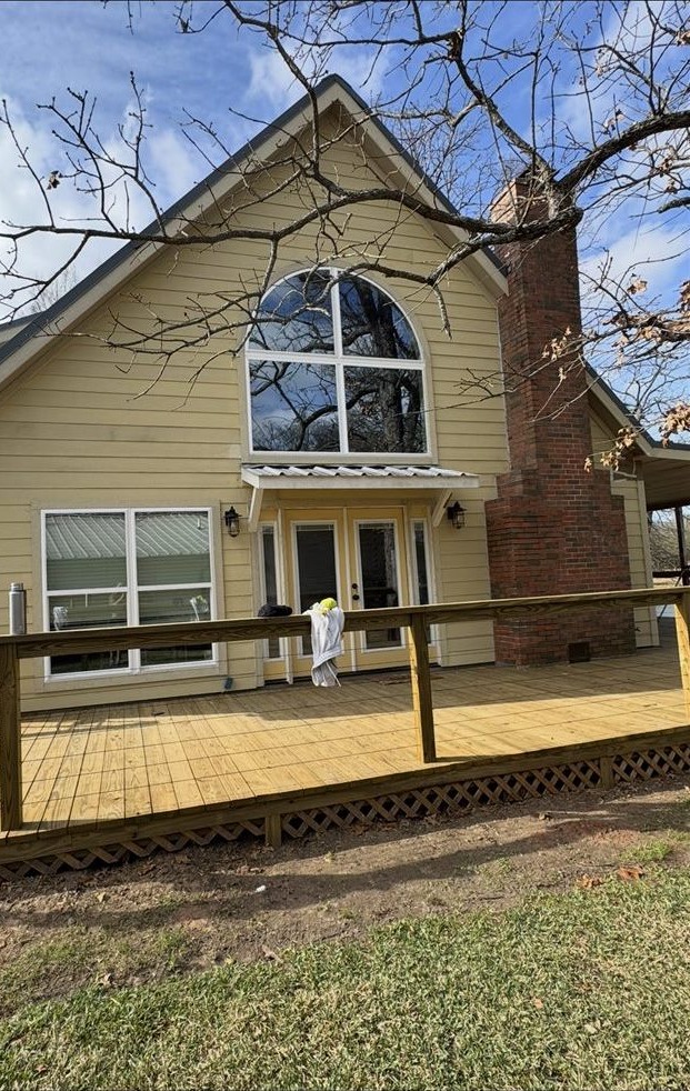 Home exterior before repainting, faded tan siding, house painter project in the Brazos Valley, TX (College Station and Bryan)